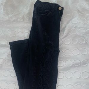 Black holy skinny jeans